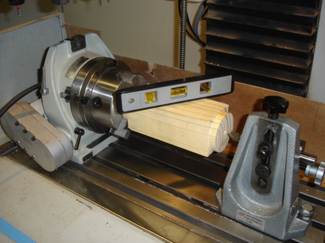 The setup of the machine and wooden blank.